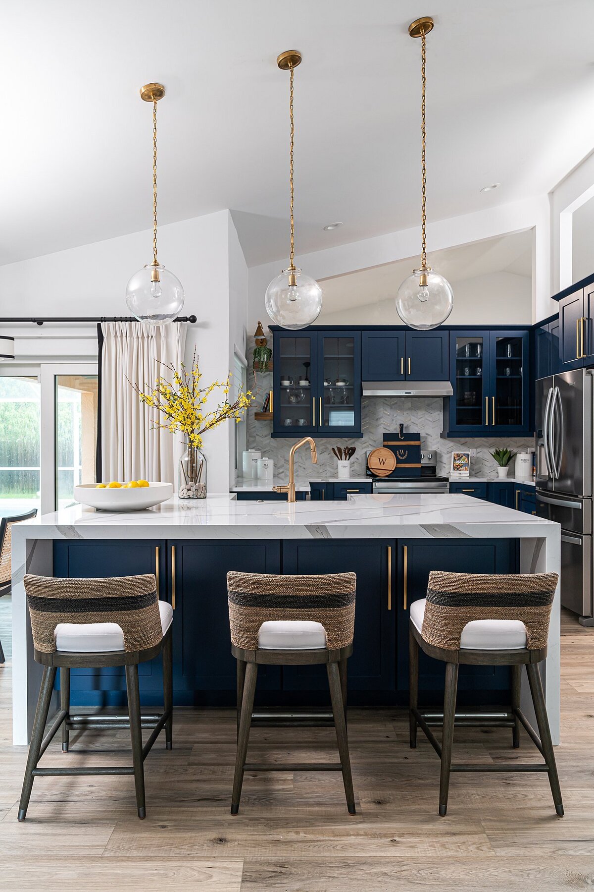 coastal luxury home navy blue kitchen full service interior design by Island Home Interiors Lake Nona