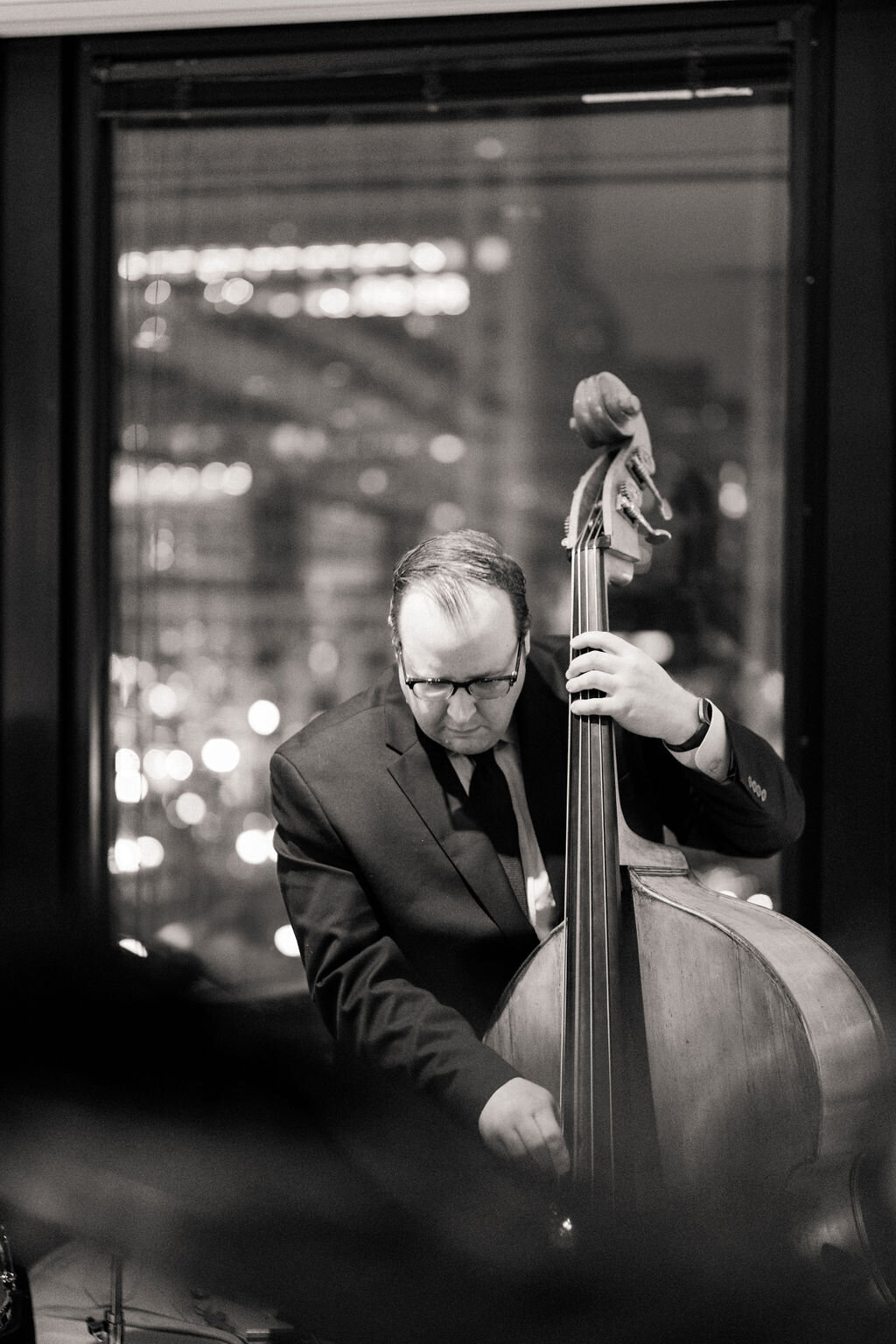 Close up photo of a man playing the instrument. 