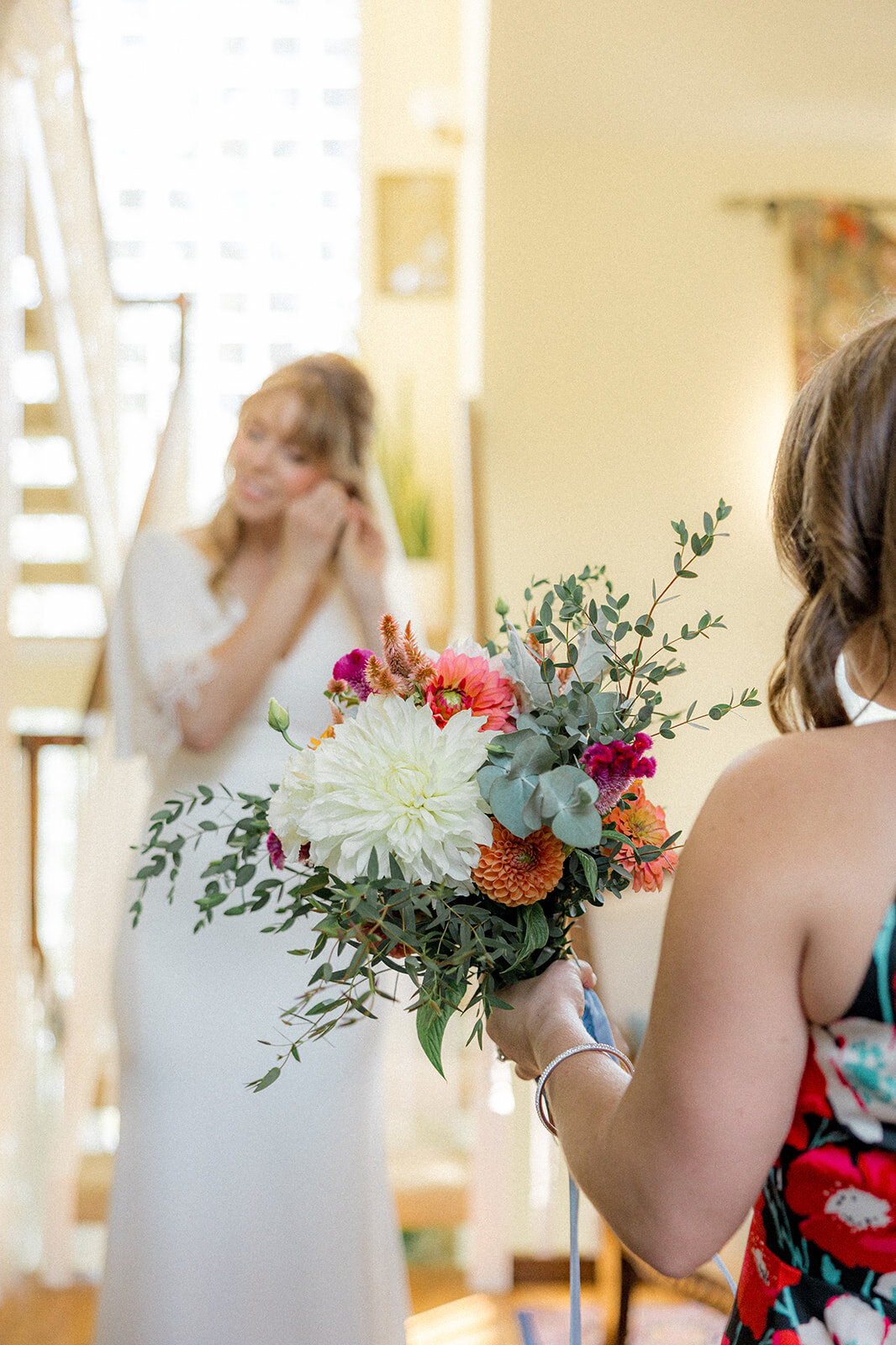 Close up of wedding bouquet  with bride in the background