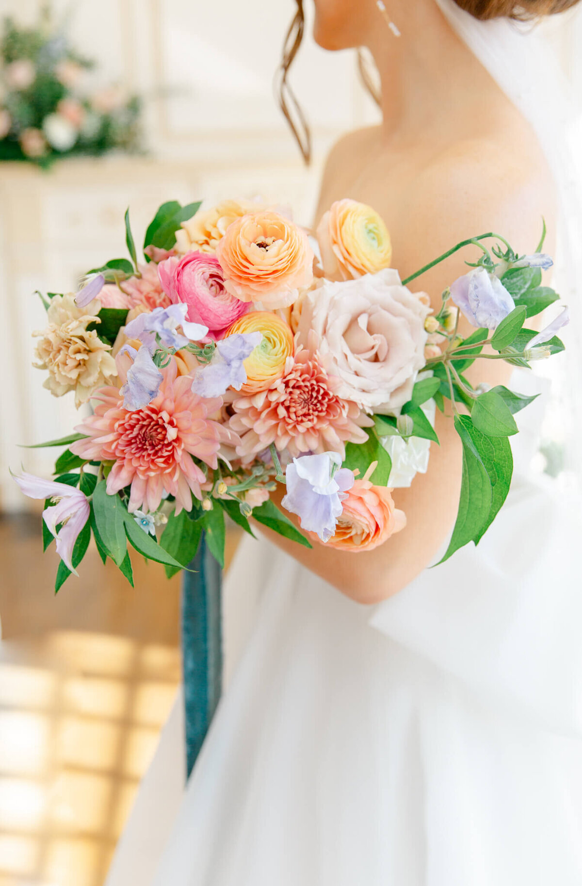 Bride holding colorful bouquet during bridal portraits at The Estate at River Run in Maidens, Virginia. Captured by Charlottesville Wedding Photographer Bethany Aubre Photography.