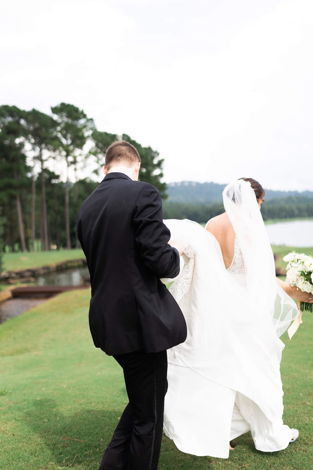 groom-carrying-bride-dress