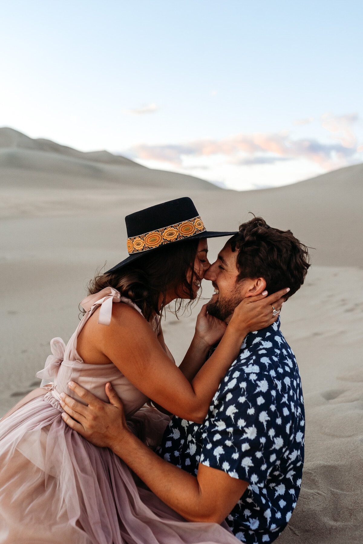 Couple kissing at the Great Sand Dunes in Southern Colorado