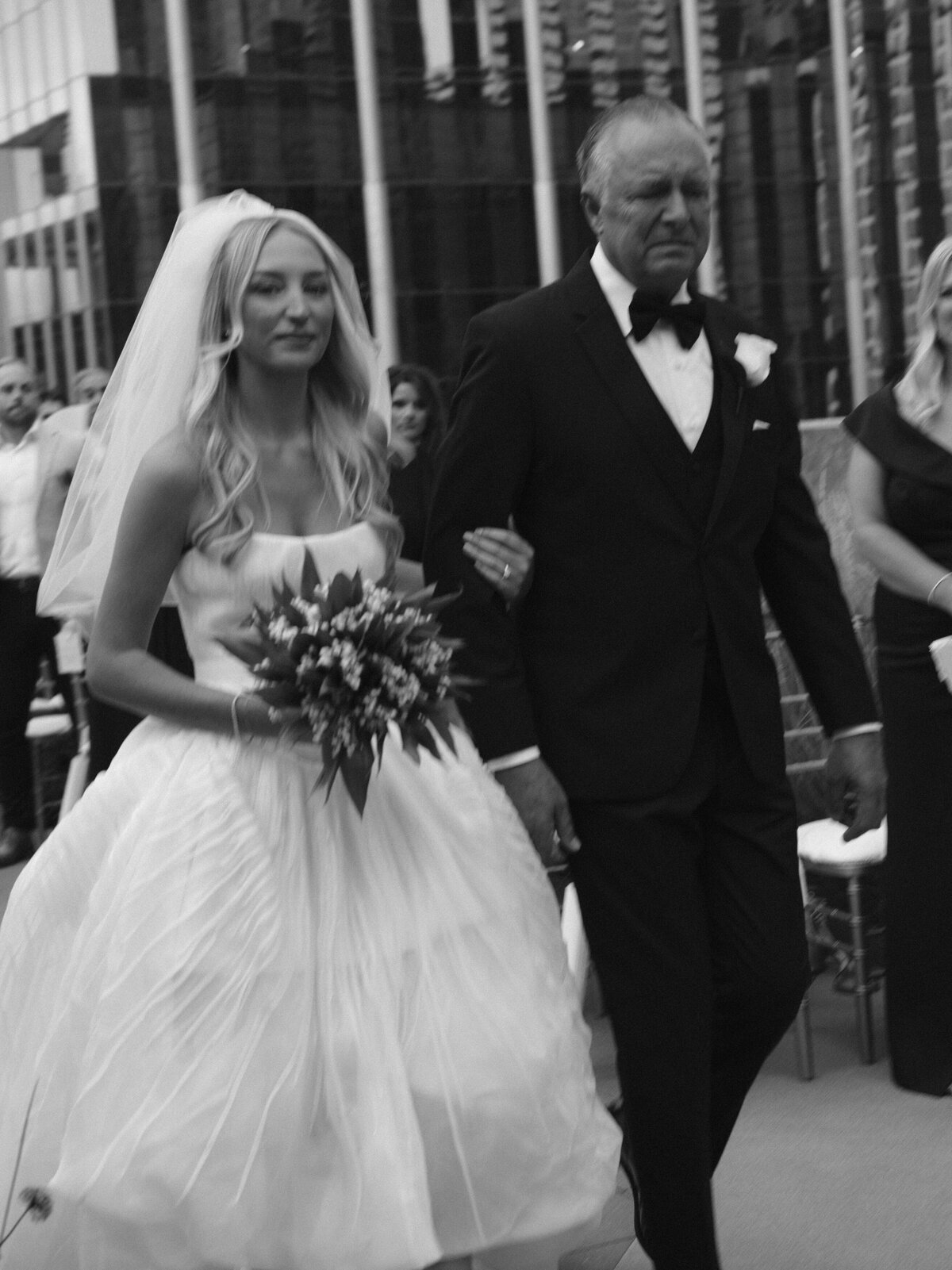 Sophisticated editorial wedding photography at Old Post Office Chicago featuring Lauren Alatriste's fashion forward approach to ceremony coverage, creating magazine-worthy imagery that balances architectural beauty with luxury wedding aesthetics.