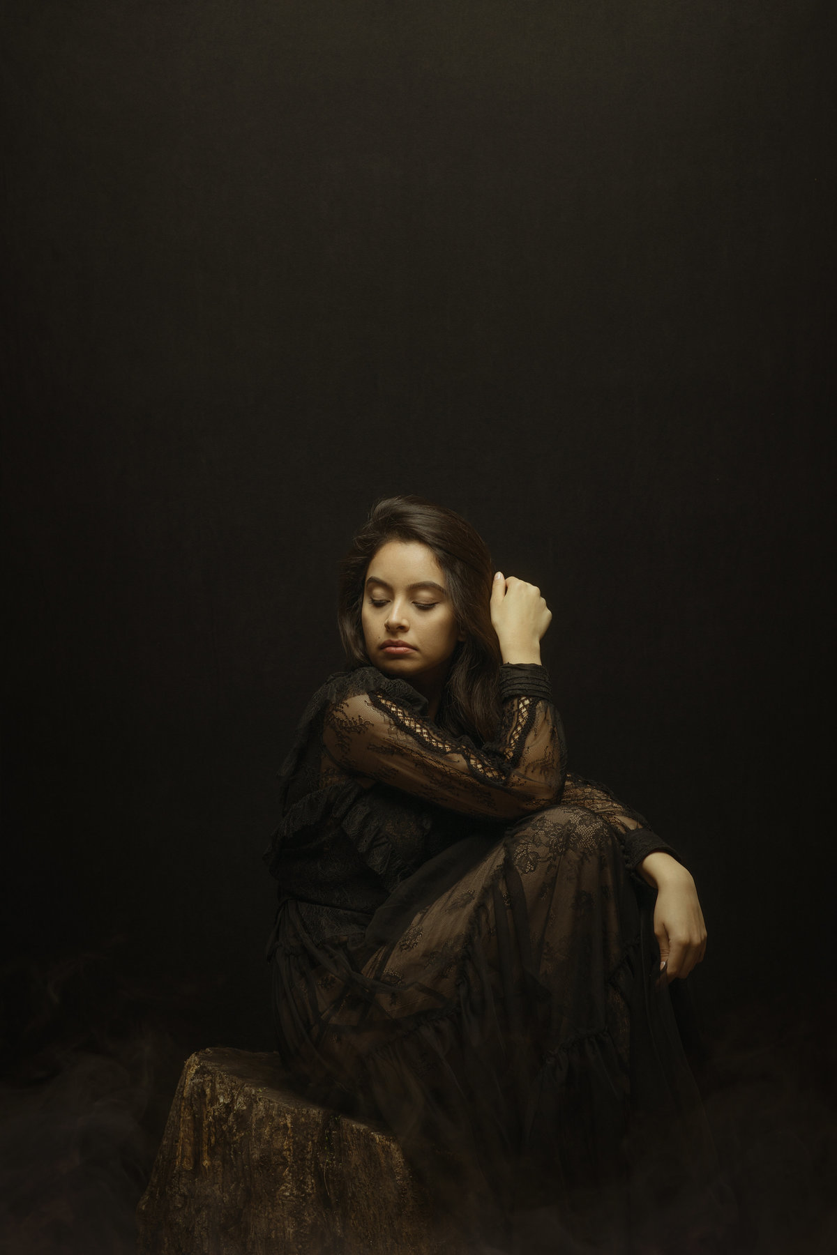 Portrait Photo Of Young Woman In Black Dress Sitting On a Wood Los Angeles
