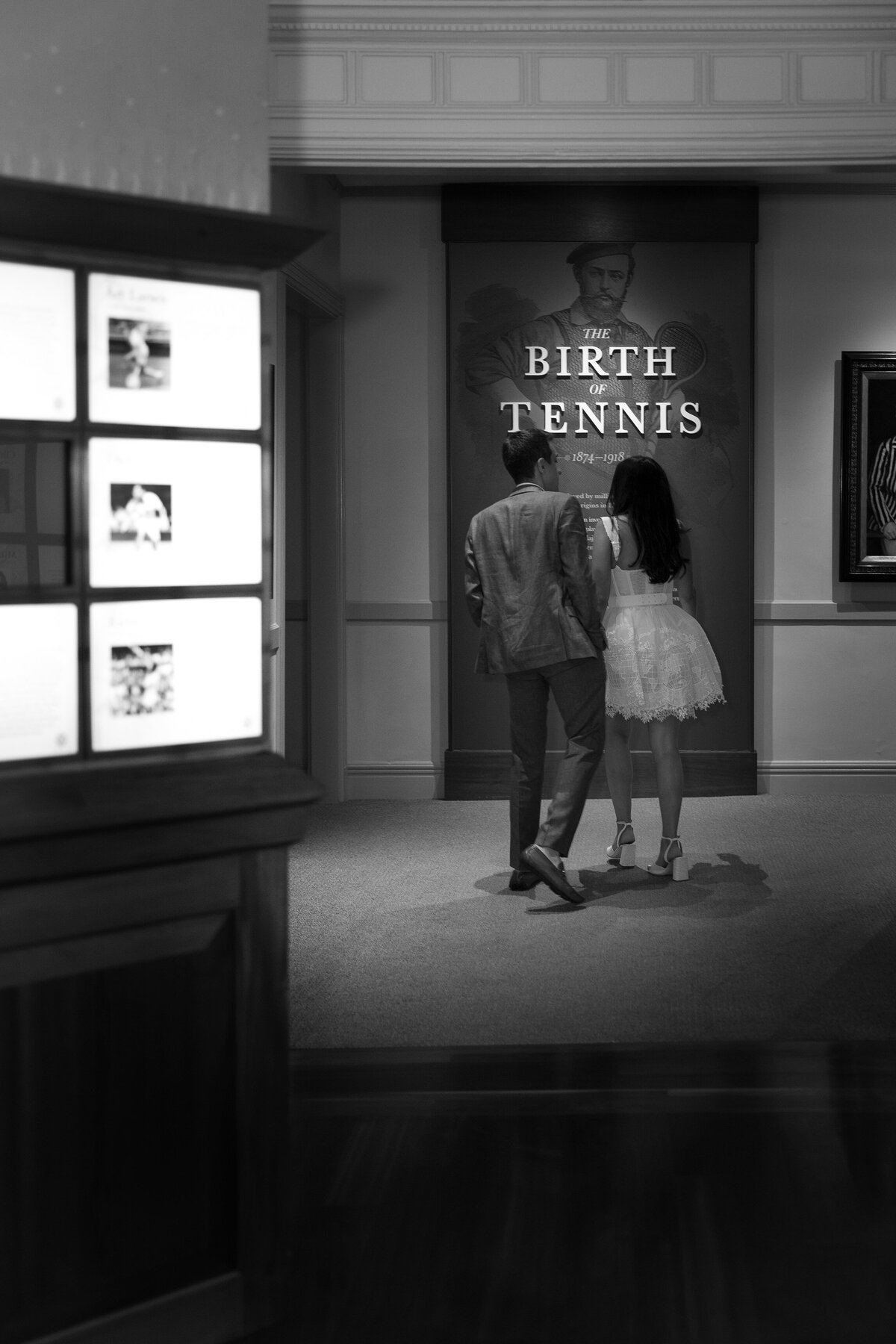 Couple wander the halls at the museum of the Tennis Hall of Fame Newport Rhode Island.