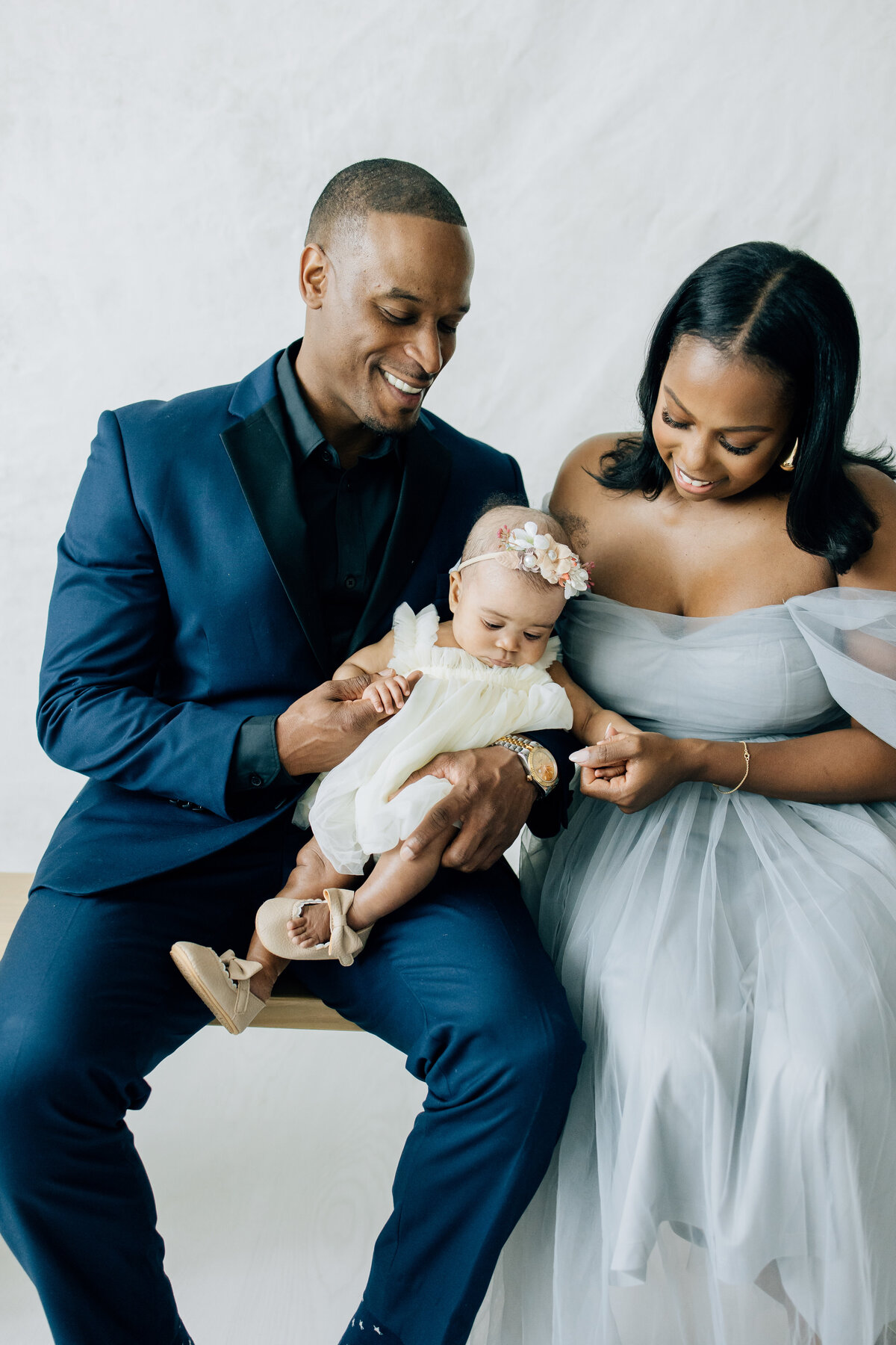 Studio formal family session with infant daughter located in Lewisville, TX
