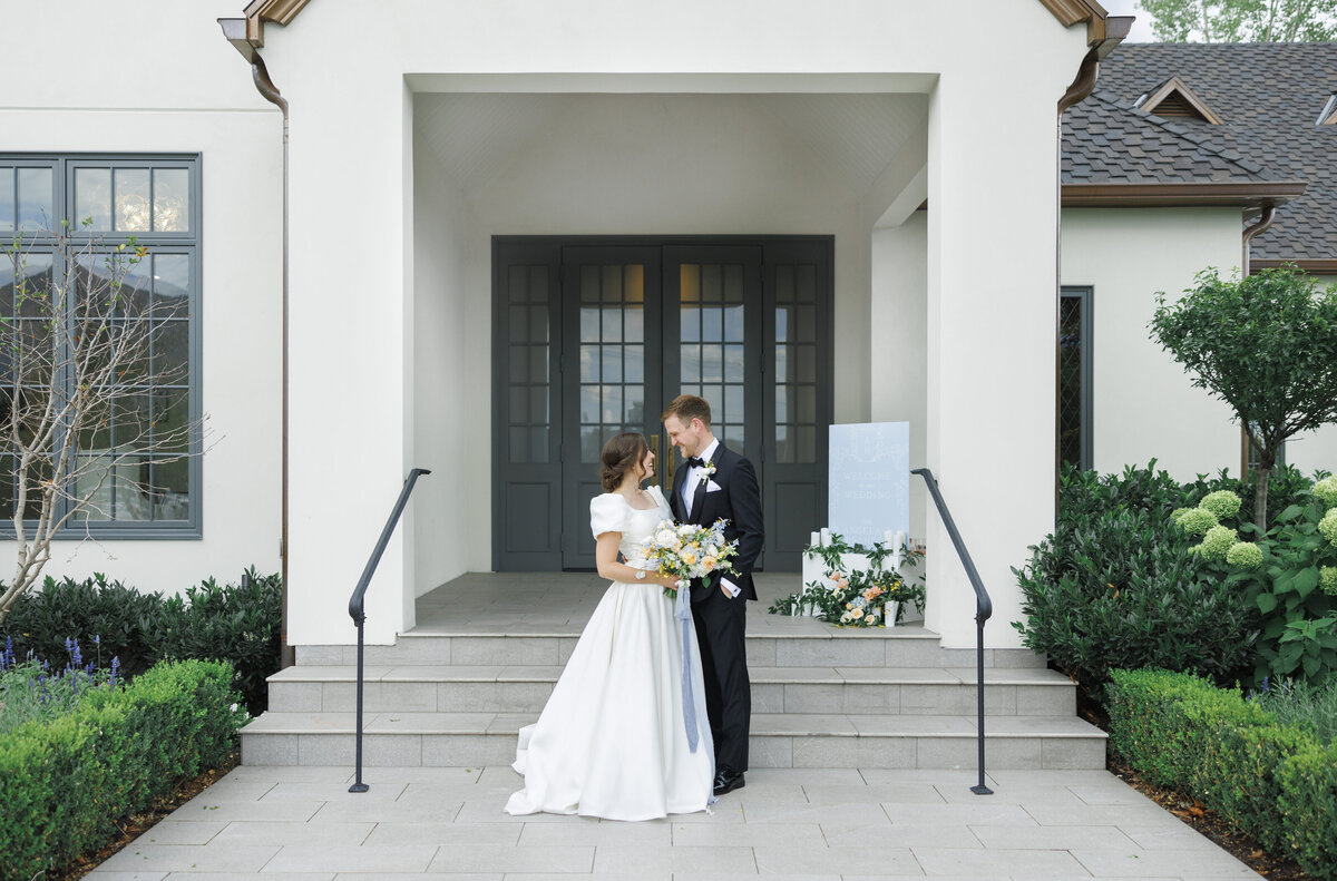 Bride and groom wedding day pictures outside their Utah wedding venue