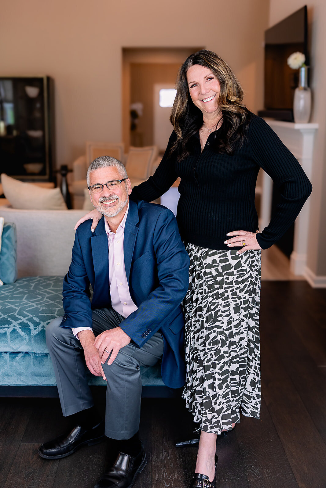 Owners of Arciera Home Care posing together while smiling