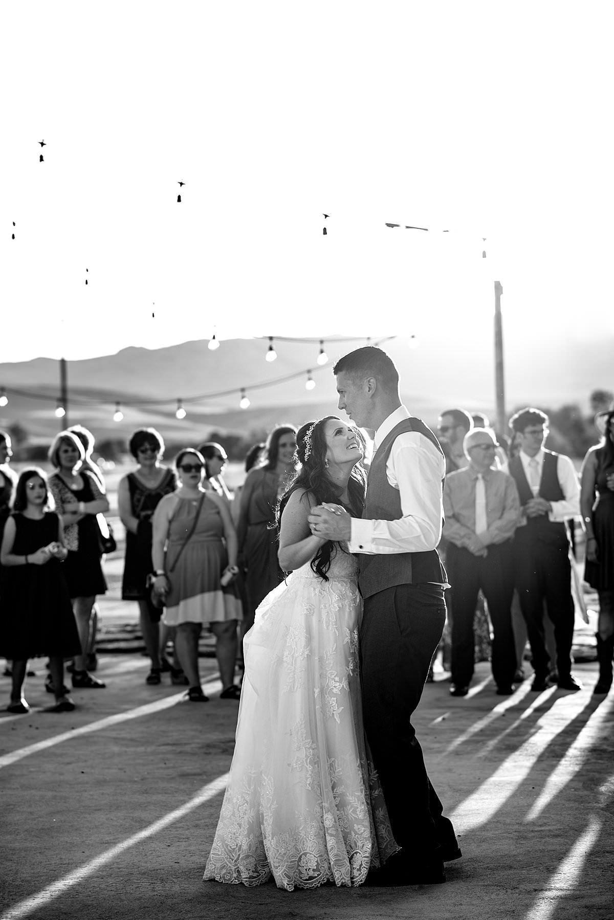 Romantic black and white photo of couple dancing their first dance