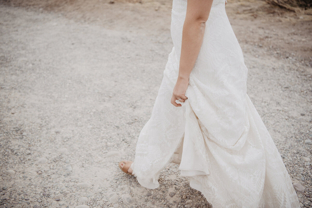 Photographers Jackson Hole capture bride walking barefoot
