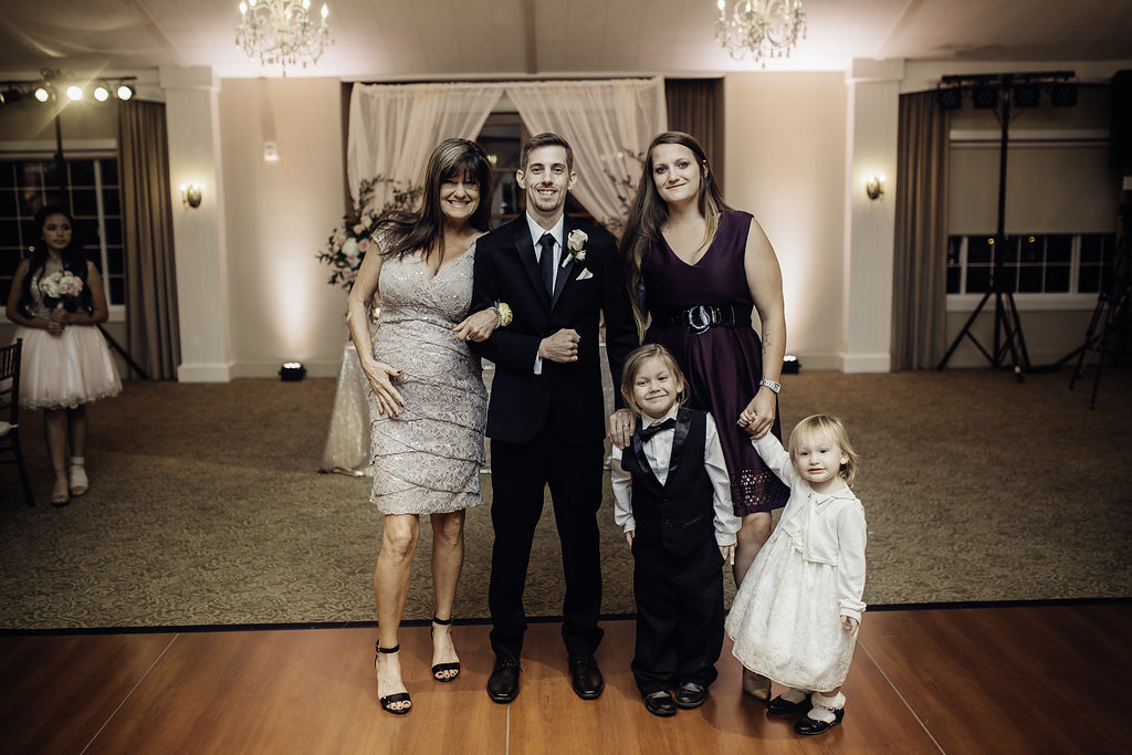 Wedding Photograph Of Man in Black Suit, Two Women and Two Kids  Los Angeles