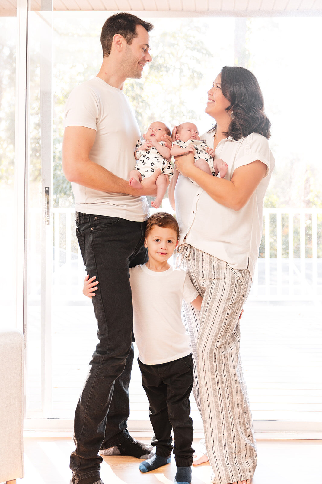 In-home lifestyle family session with mom, dad, toddler, and newborn in Orlando Florida home


