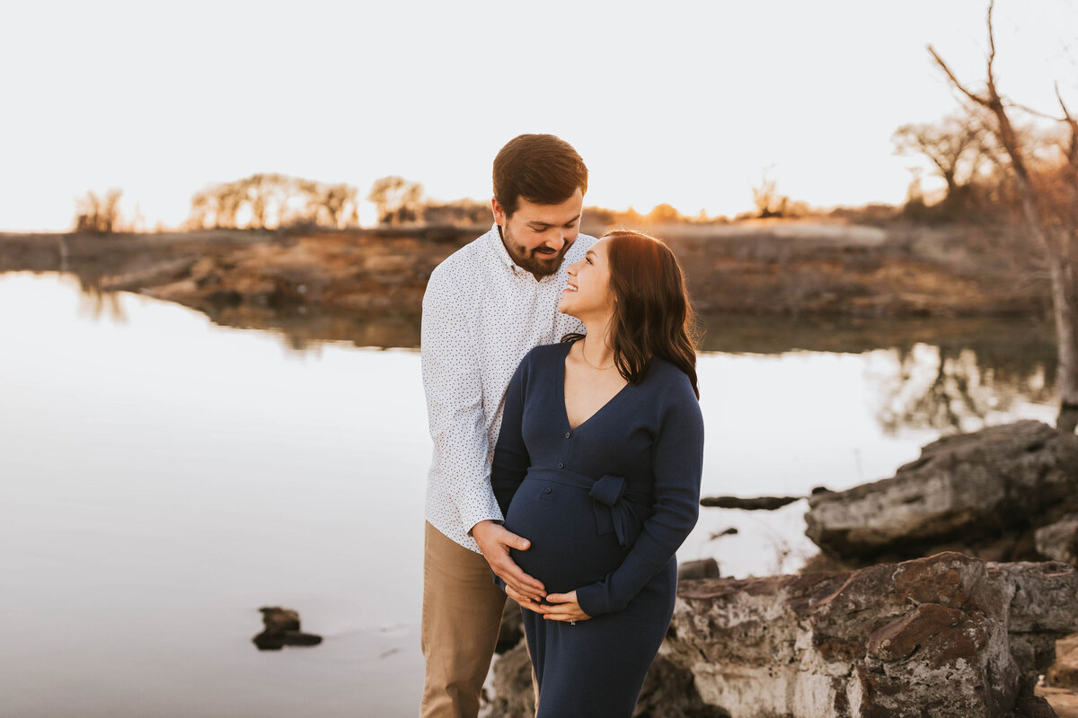 Pregnant couple at the lake