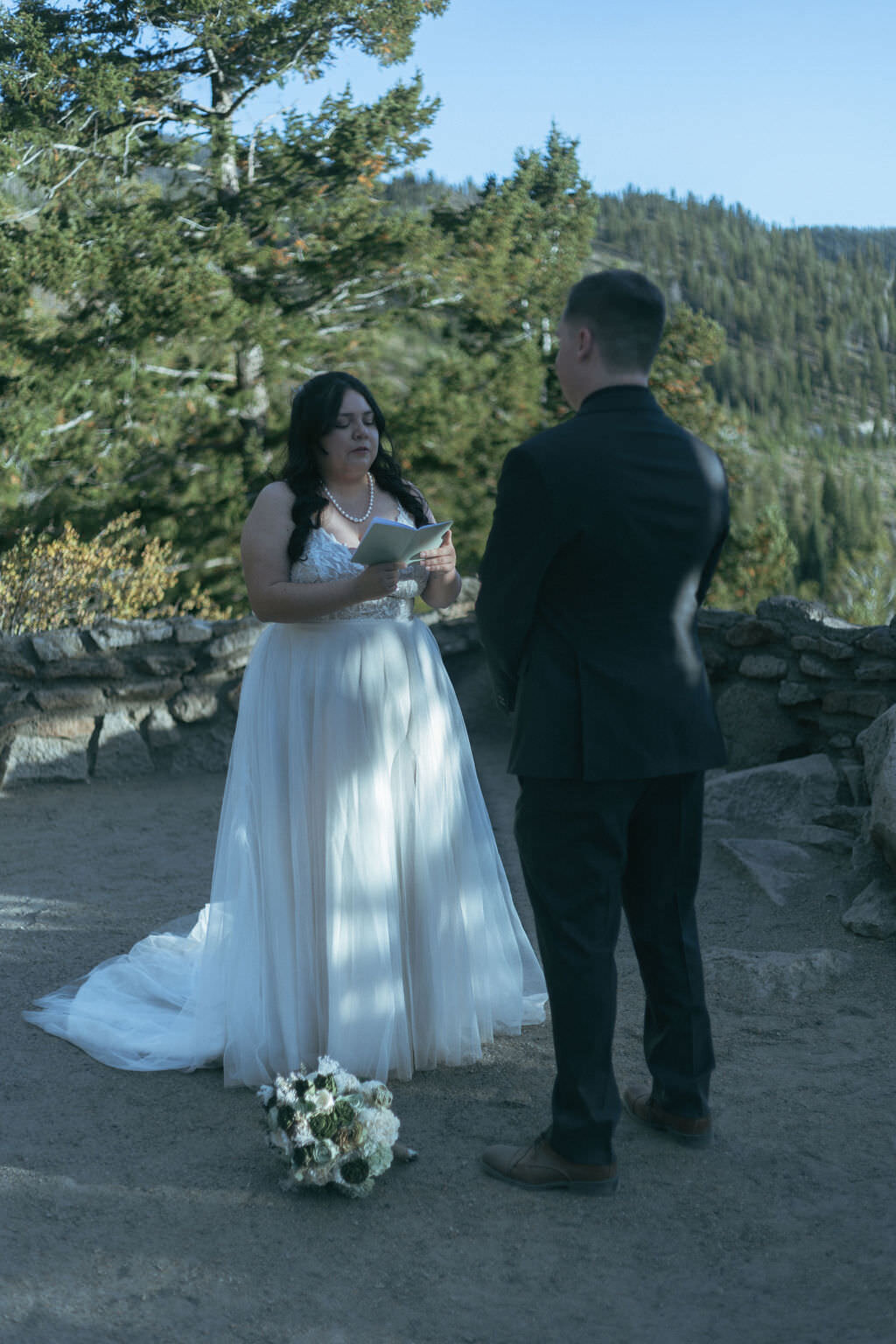 A person reading their vows to their partner.