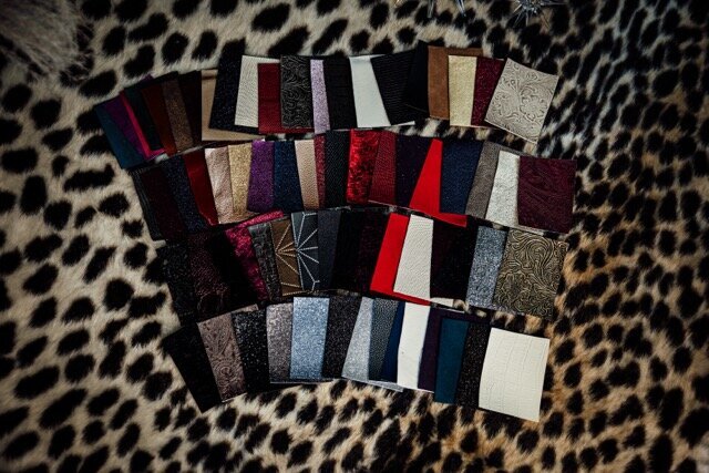 Boudoir photography album cover swatches on leopard rug in Lubbock, Texas photographer in Amarillo TX