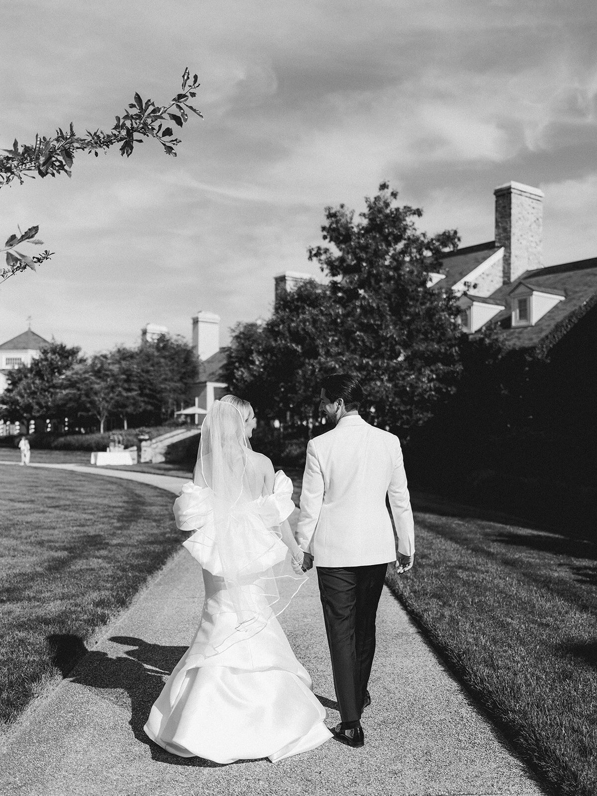 Couple walking side by side towards reception