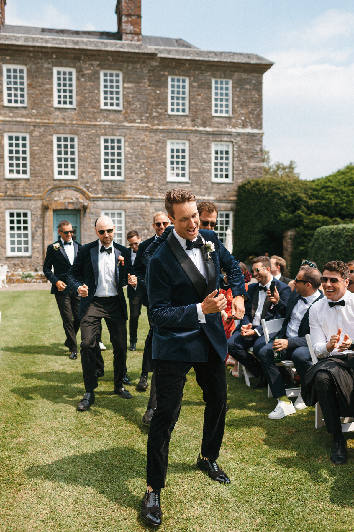 Groom enters dancing down the aisle at his Kingston Estate wedding