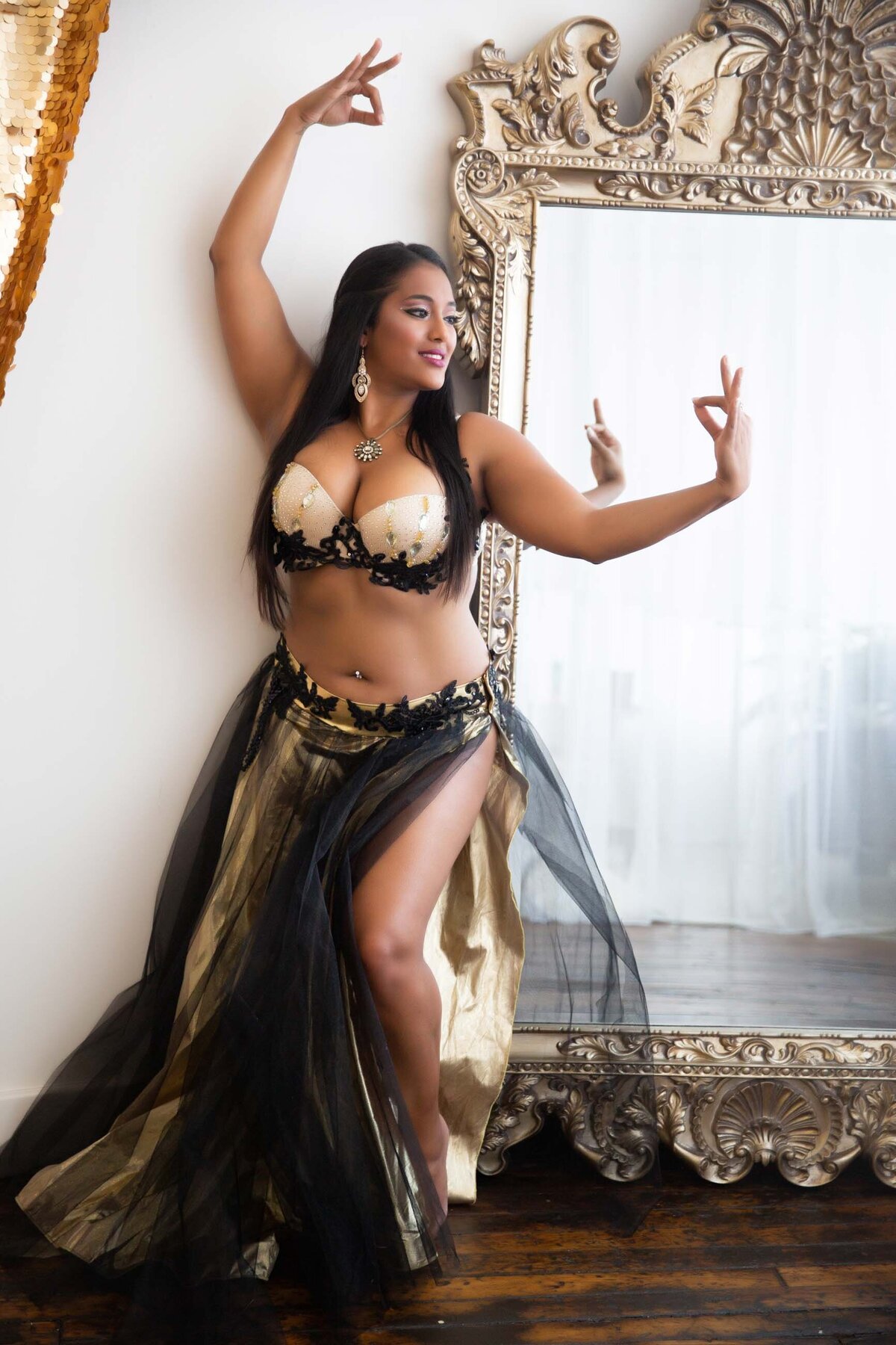 Woman posing in traditional costume for artistic boudoir portrait