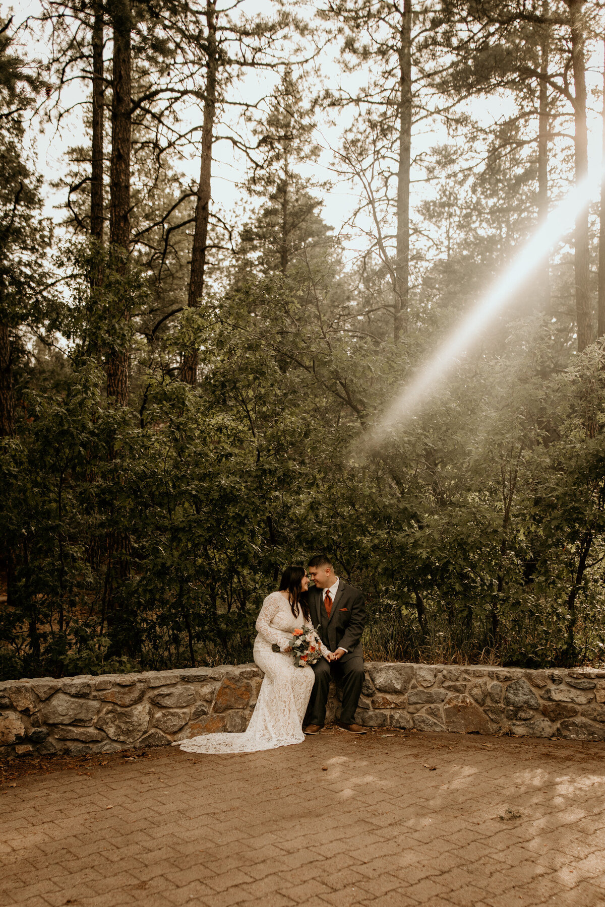 bride and groom sitting together in Cedar Crest NM