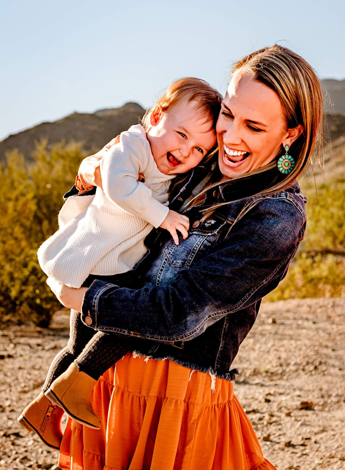 mom and daughter laughing during session with AZ family photographer