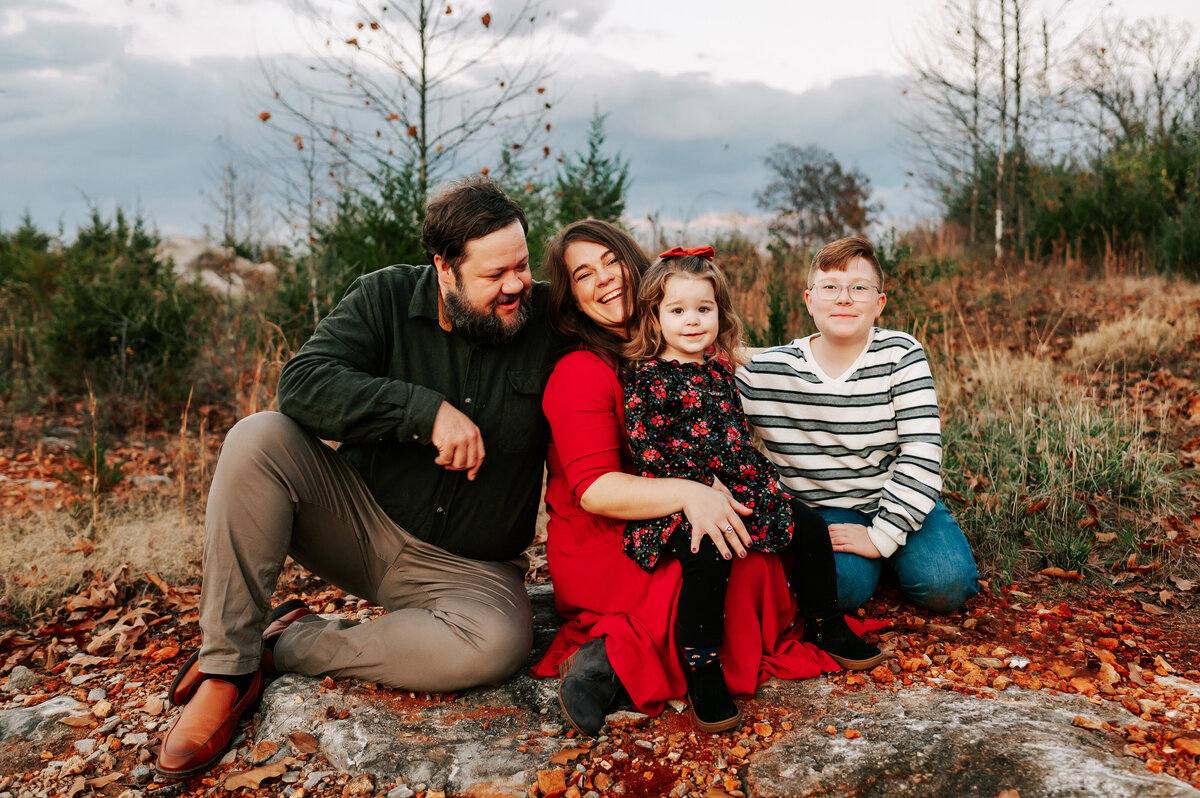 family photo in Branson MO of family  sitting on rocks