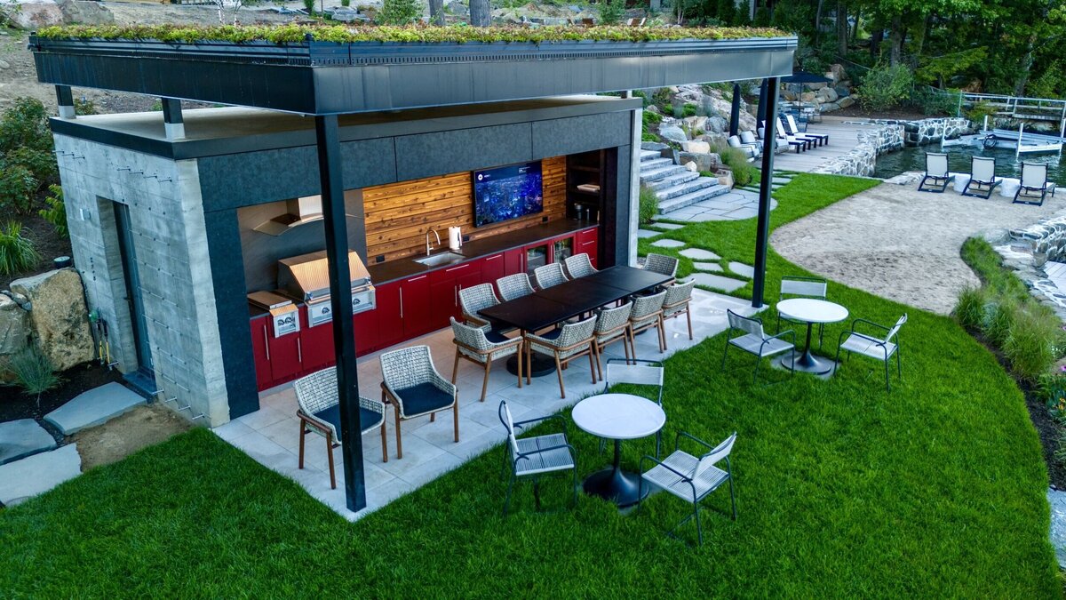 Outside kitchen with lots of seating and dark accents