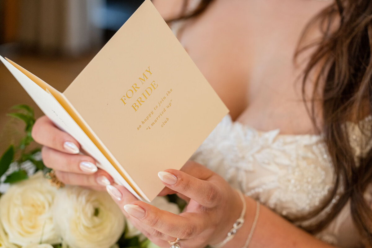 A woman is reading a book titled for my bride