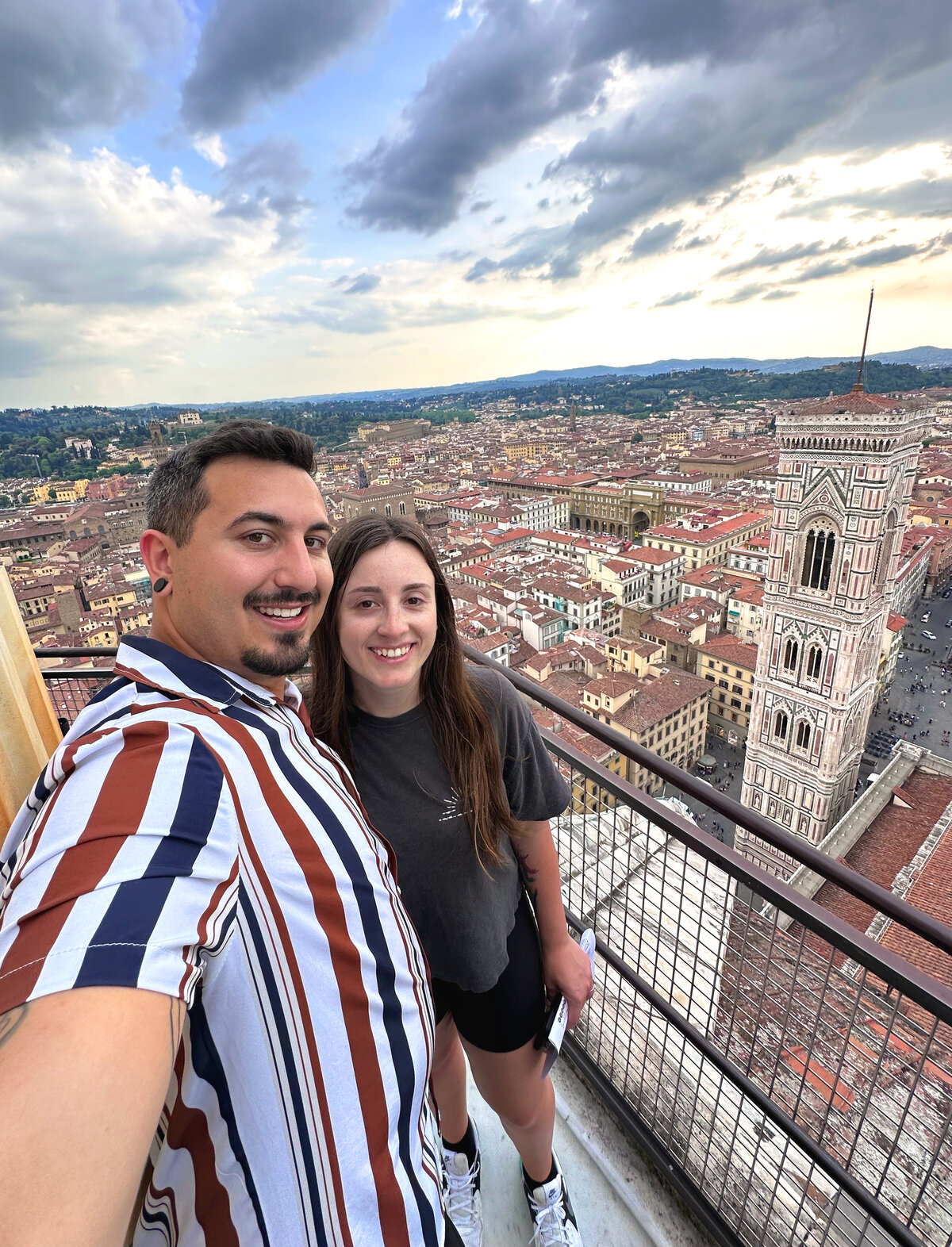Brittany & Jake pose on a rooftop in Europe during their DWD planned vacation 