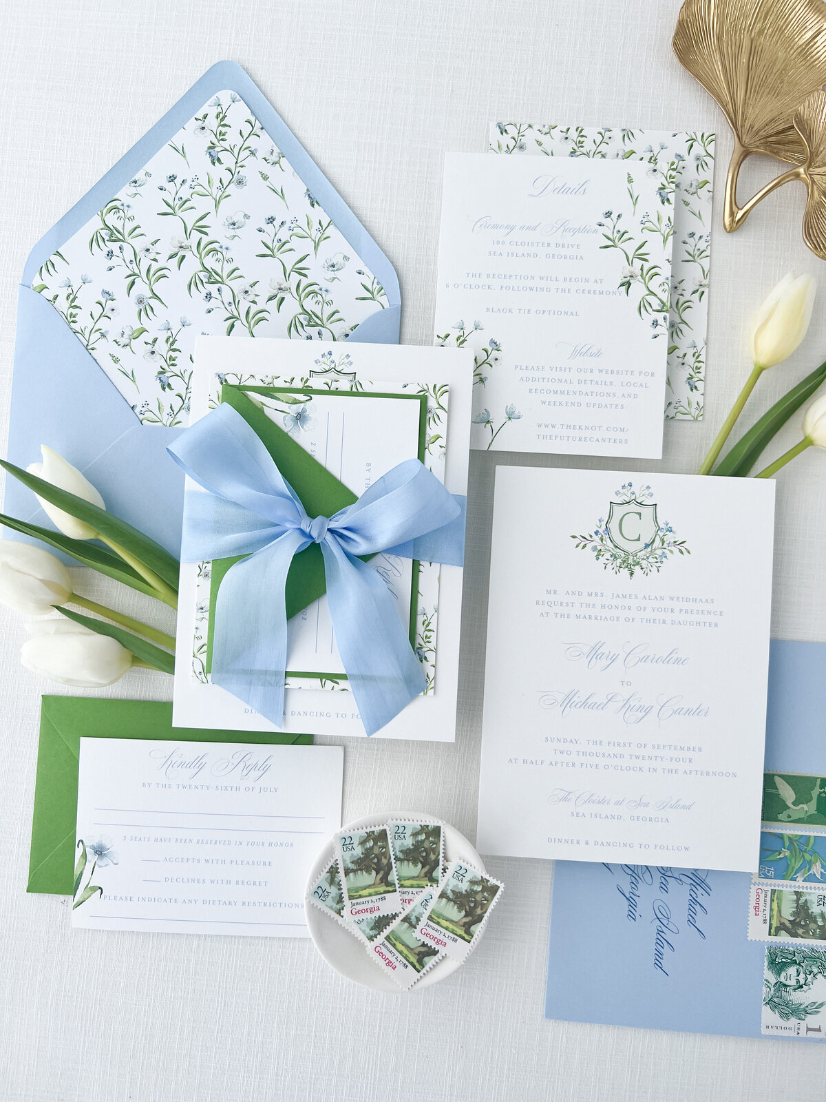 wedding invitation suite embellished with bows and a botanical pattern