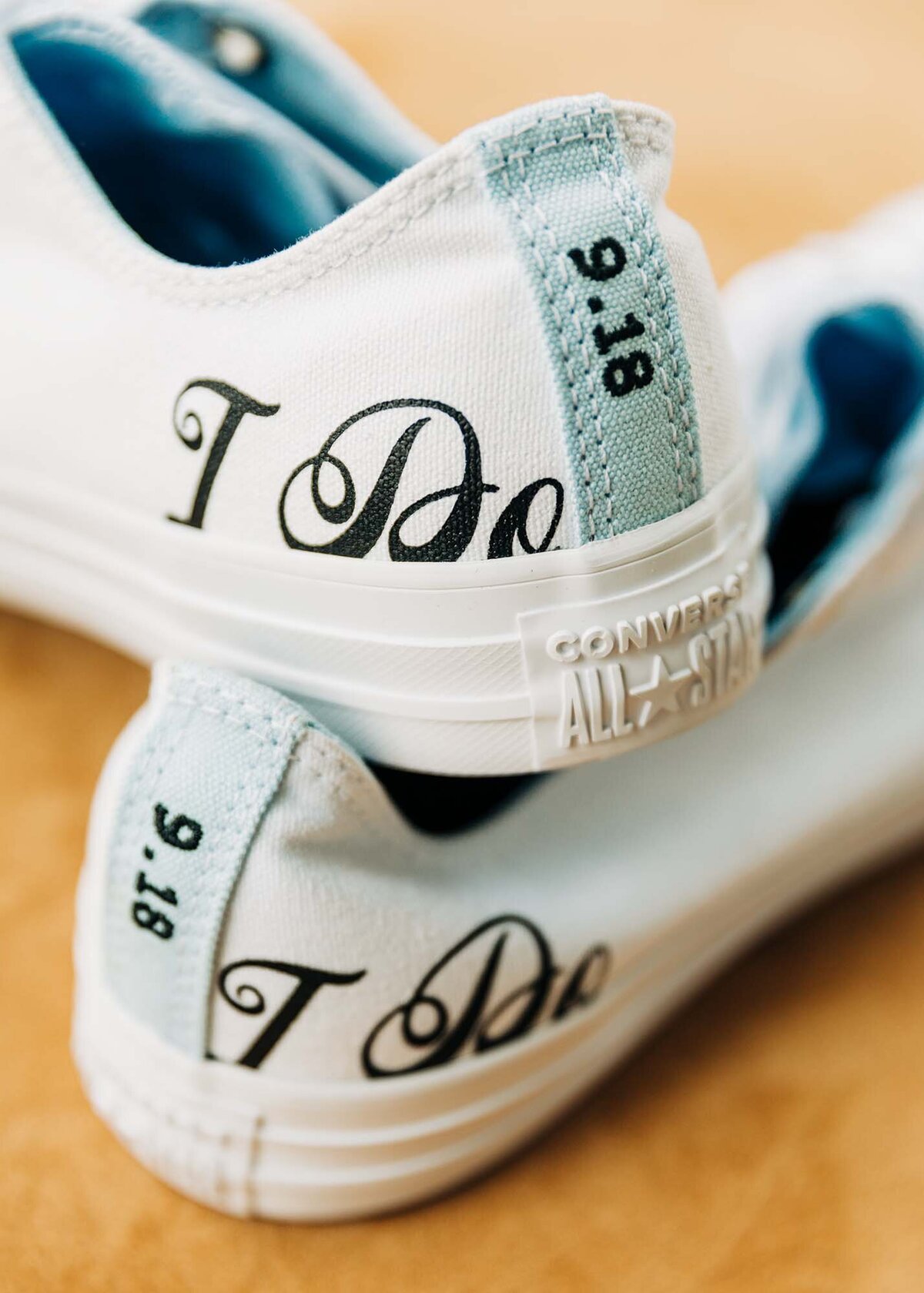 Converse All Star white 'I Do' tennis shoes on wedding day