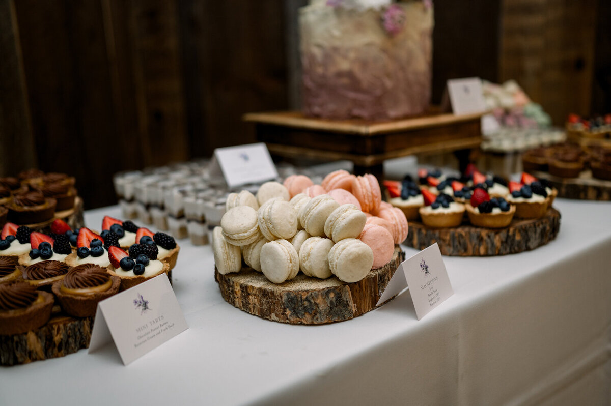 Stylish dessert table at a summer wedding reception held at The Woodlands at Cottonwood Canyon in Montana.