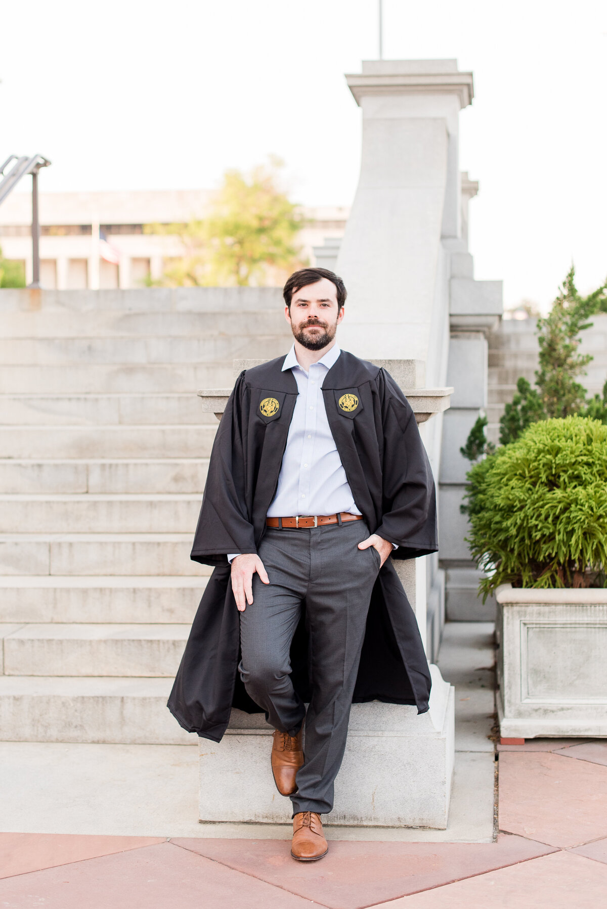 law grad  leaning on wall