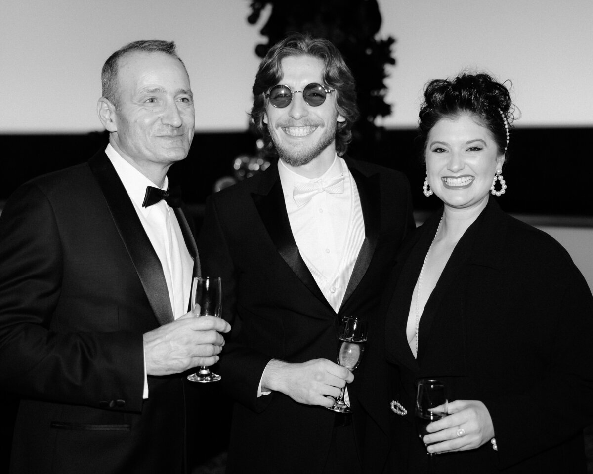 Black and white photo of 3 Regal Cinema wedding guests.