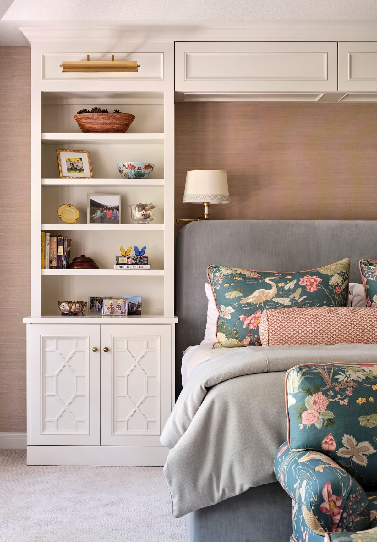 the keeping room interiors morningside bedroom with white shelves and colorful pillows