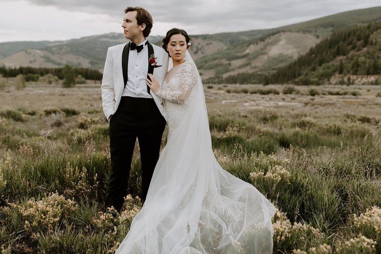 Bride and groom portrait with a mountain backdrop