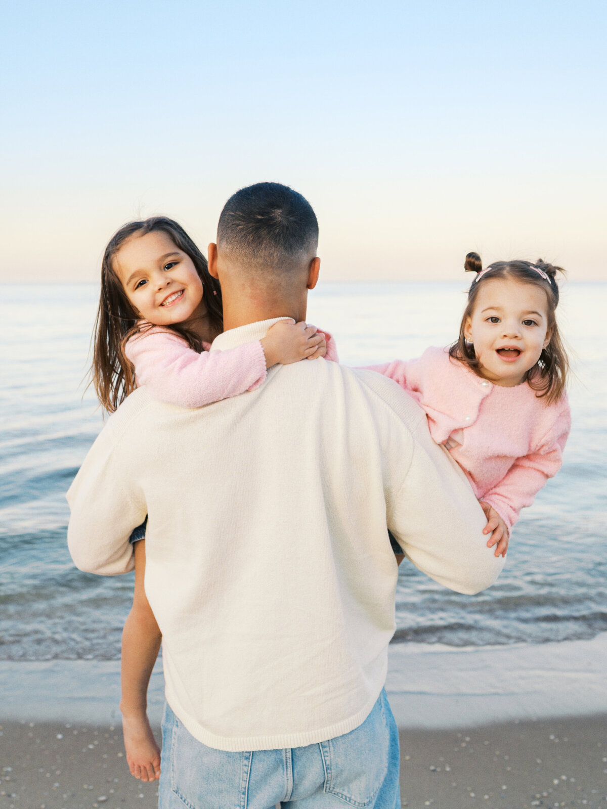 father-and-daughters-looking-at-beach