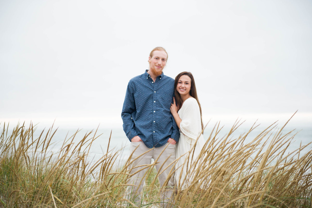 overcast skies and photos in grasses on beach