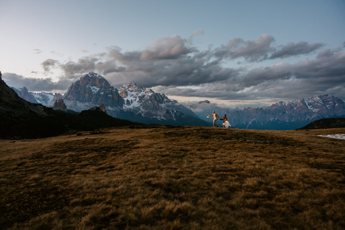 romantic couple during twilight elopement in Dolomites
