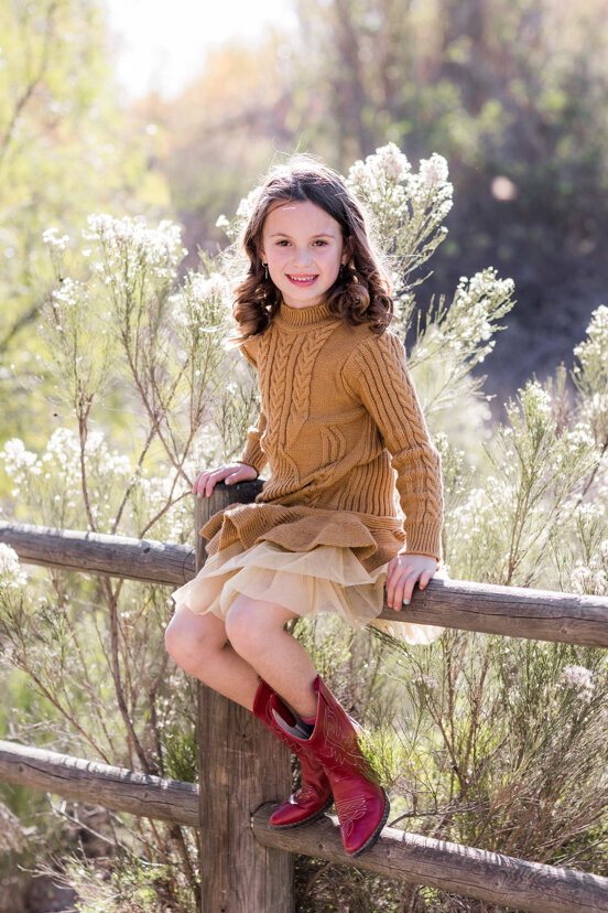young-girl-sitting-on-fence-Bonita-San-Diego