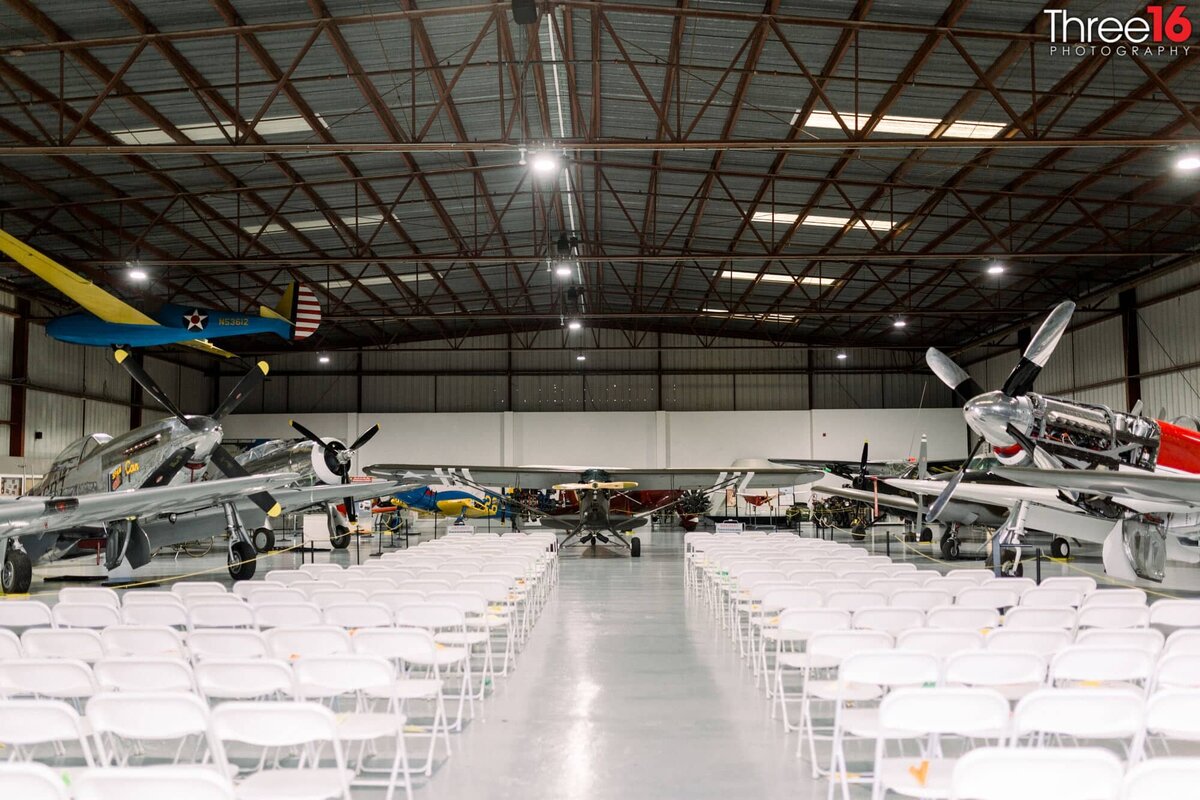 Wedding ceremony setup inside the Planes of Fame Air Museum hangar