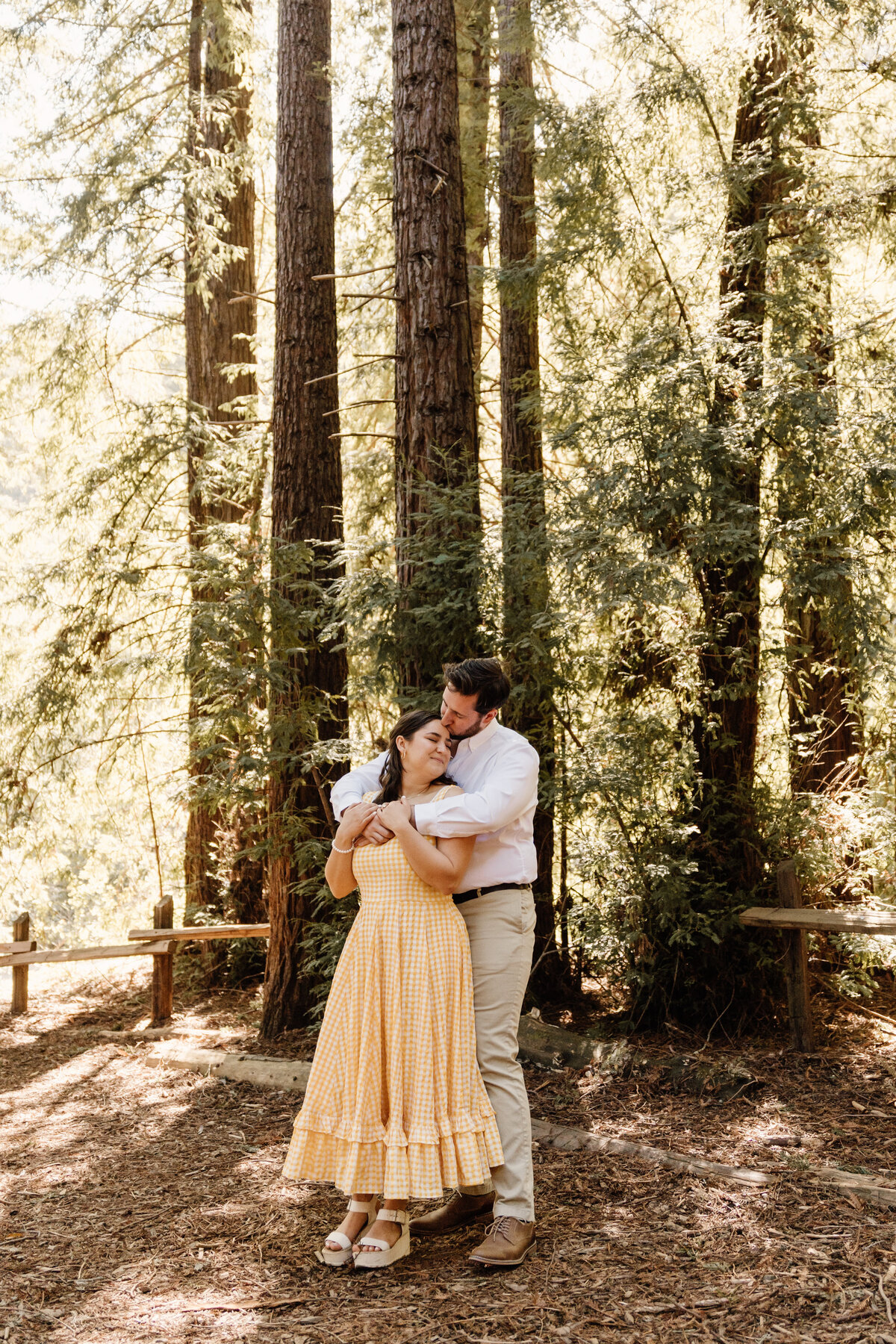 couple hugs in oakland redwoods
