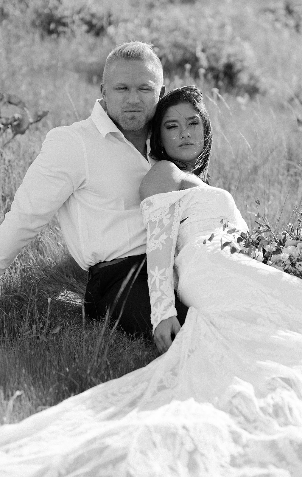black-and-white-portrait-of-bride-and-groom-look-at-the-camera