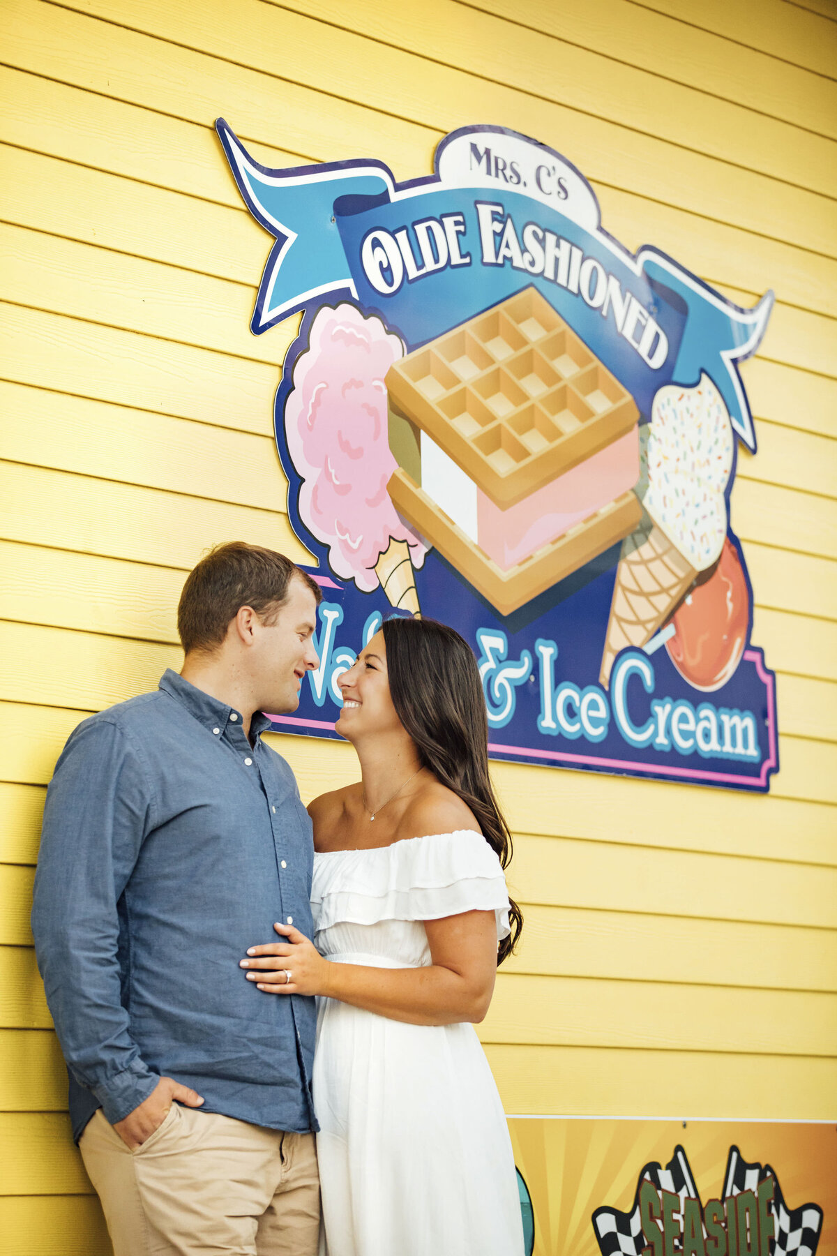 Point Pleasant Engagement Session | Couple on Boardwalk Near Ice Cream Sign | New Jersey