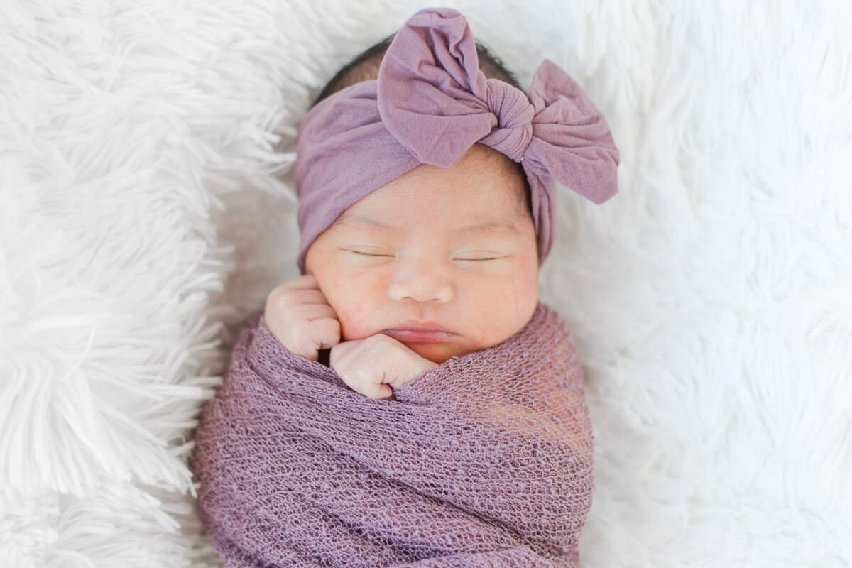 Newborn session sleeping swaddled baby Loveland Colorado