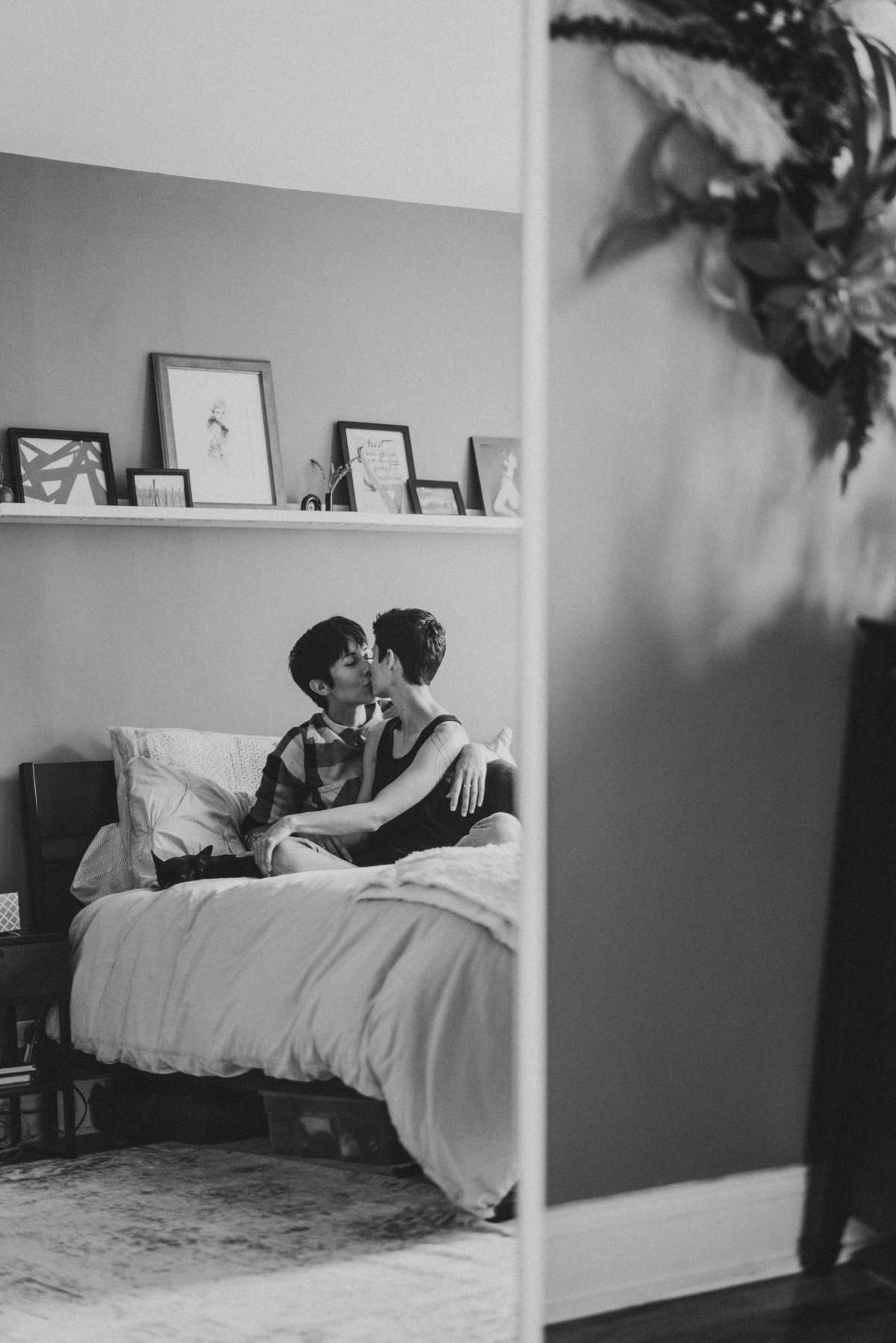 BLACK AND WHITE LESBIAN COUPLE IN HOME PHOTOGRAPHY COUPLES SESSION