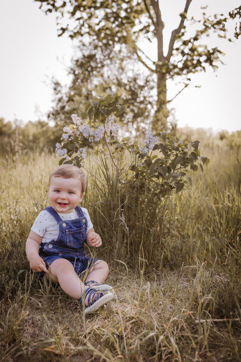 Child sitting in grass