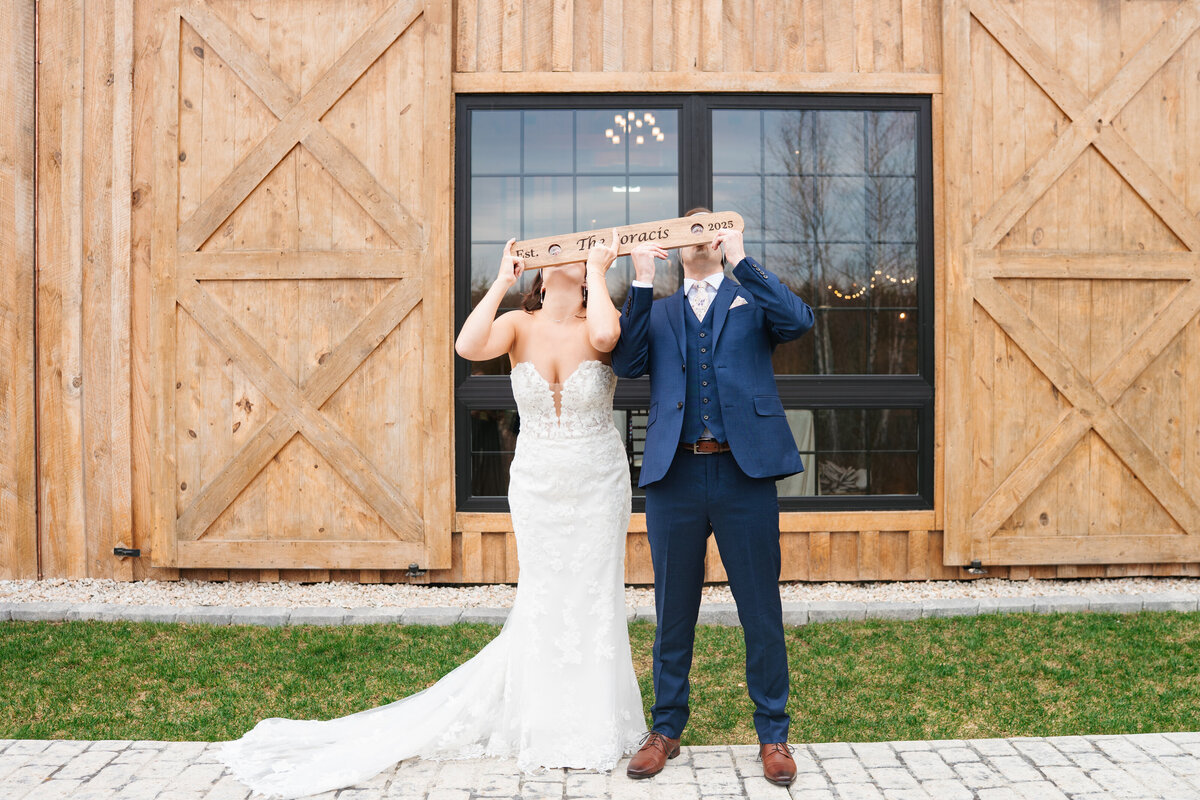 First look between bride and groom on a tree-lined path
