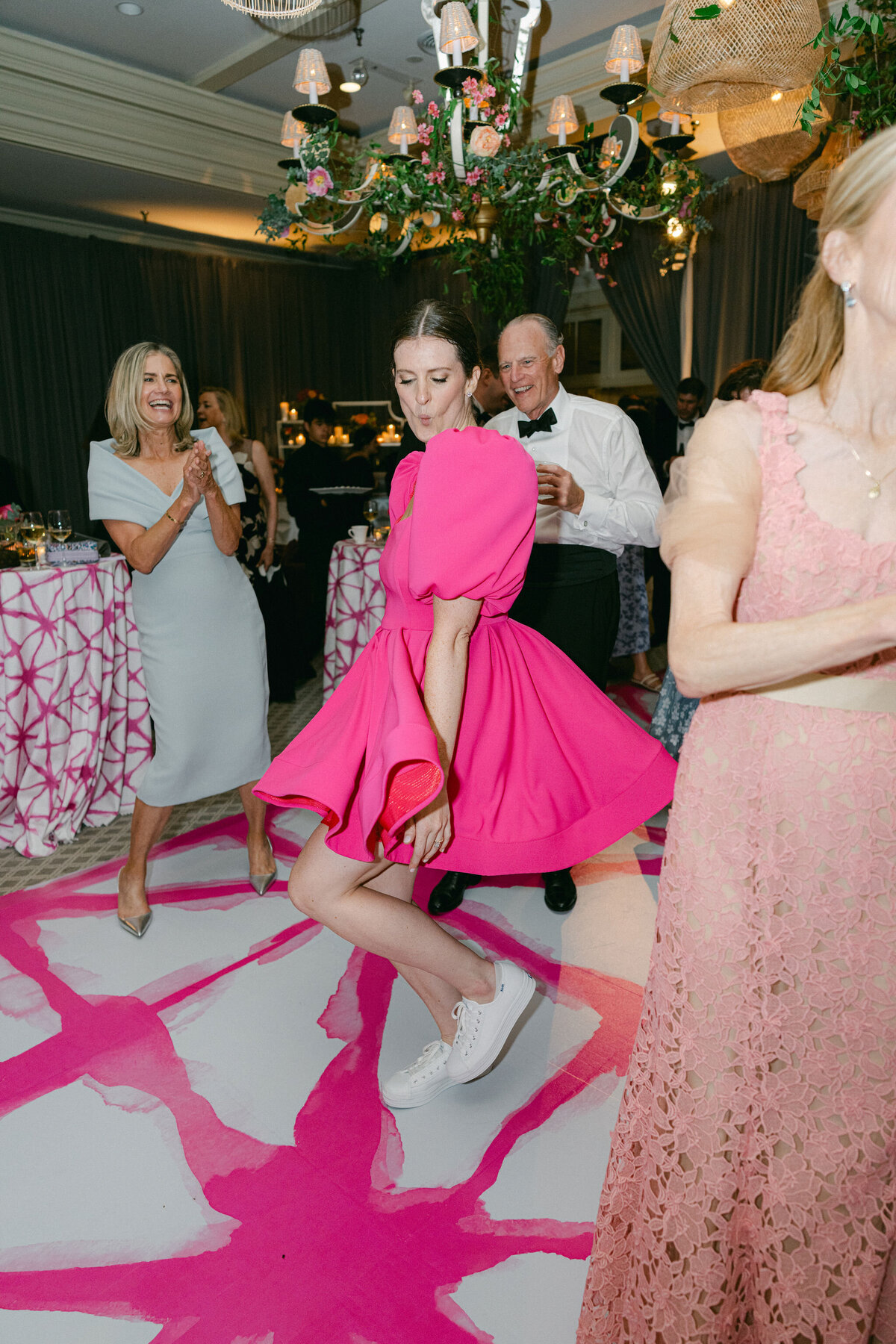 The bride in a party dress on the dance floor. 