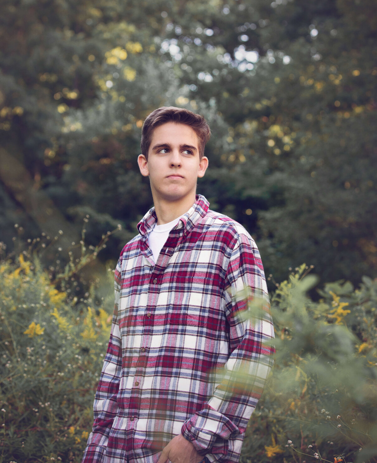 Erie Pa senior guy standing in a field at on Behrend Campus in Erie Pa