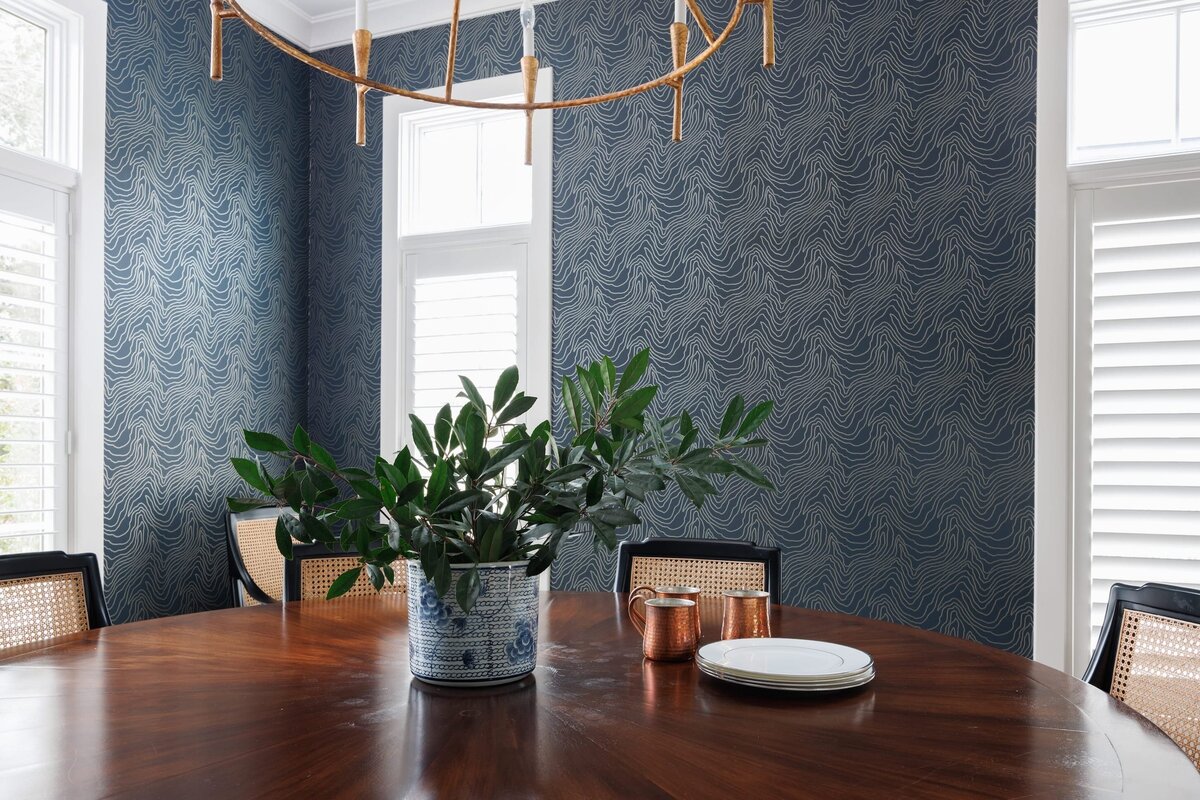 the keeping room interiors primera dining room table with copper mugs and plates on wooden table